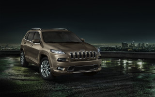 Brown jeep roof night city - a dark sky above free wallpaper