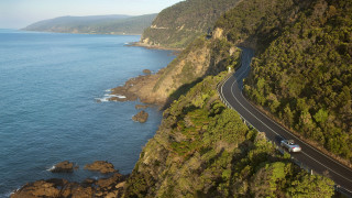 Car driving road ocean cliff - anson maddock free wallpaper
