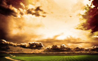 Green field dirt road cloudy 2 - a sunbeam in the distance free wallpaper