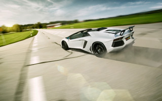 White sports car green field - a green field behind free wallpaper