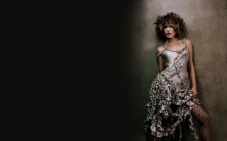 Woman dress flower wall crossed - against a wall free wallpaper