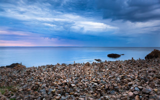 Rocky beach stormy water sky - a rocky beach free wallpaper
