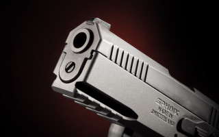 Gun red light black background - a close up of a gun free wallpaper