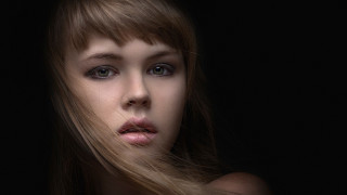 Woman longhair blackbackground serious look - portrait photography free wallpaper