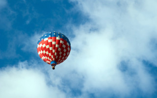 Hot air balloon cloudy blue - a hot air balloon free wallpaper
