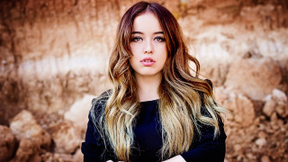 Woman long hair rock wall 2 - a rock wall free wallpaper