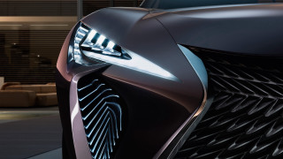 Futuristic ai mitsu car headlight - a close up of a car free wallpaper