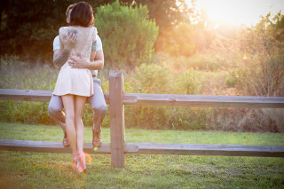 Couple standing fence grass field - a couple of people free wallpaper
