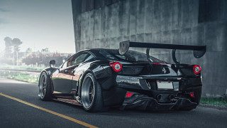 Black sports car driving building - a large window free wallpaper for desktop