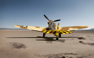 Small airplane desert footprints beach - colin hayes free wallpaper