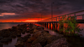 Wooden bridge sunset water rocks - rich moody colours free wallpaper