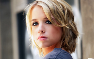 Blonde blue eyed serious portrait 3 - her face and shoulder free wallpaper