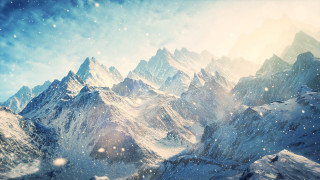 Snowy mountain range sunny clouds - a bright sun free wallpaper