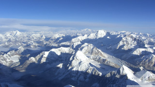 Mountain range airplane window view 2 - an airplane window free wallpaper