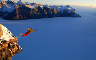 Man jumping cliff snowboard mountain 3 - extreme free wallpaper