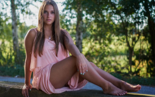 Woman pink dress sitting woods - free beach wallpaper