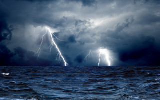 Storm ocean lightning boat night - a storm free wallpaper
