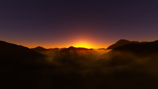 Sunset mountains bright sun clouds - a bright sun in the distance free wallpaper