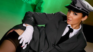 Woman suit hat posing green - her leg up free wallpaper