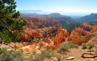 Valley mountains trees blue sky - a view of a valley free wallpaper