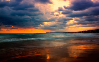 Sunset ocean clouds beach building - stormy weather free wallpaper