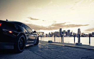 Black car city water beach - a black car free wallpaper