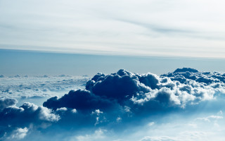 Clouds sky plane horizon ocean - a plane in the distance free wallpaper