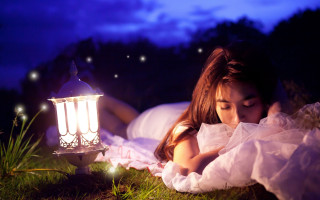 Woman laying lantern night dreamlike - a lantern free wallpaper for desktop
