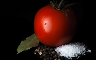 Tomato salt greenleaf blackbackground hyperrealism - a black surface free wallpaper for desktop