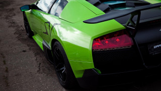 Green sports car hood up 2 - a green sports car free wallpaper