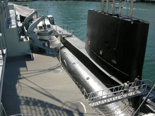 Submarine docked man deck water - carl eugen keel free wallpaper