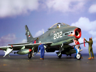 Toy model fighter jet men - another man holding free wallpaper