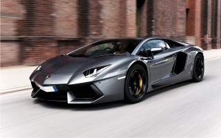 Silver sports car driving brick - a door free wallpaper