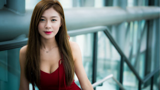 Red dress posing railing building - white background free wallpaper