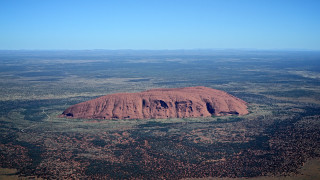 Large rock plain sky clouds - albert namatjira free wallpaper