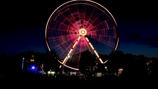 Ferris wheel night cityscape reflection 2 - side and a building in the background free wallpaper