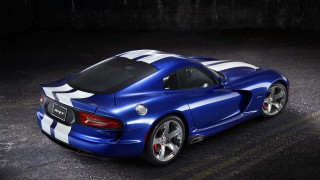 Blue sports car white stripes - a black wall free wallpaper