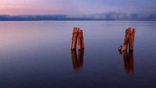 Wooden posts water sky clouds - free minimalism wallpaper