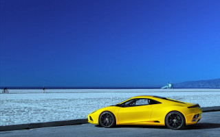 Yellow sports car beach ocean - a yellow sports car free wallpaper