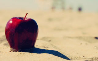 Red apple beach sand shadows - a red apple free wallpaper