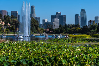 City skyline fountain boats lake - panoramic view free wallpaper