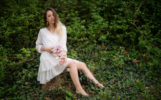 Woman sitting rock field bushes - daphne mcclure free wallpaper for desktop