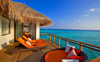 Lounge deck ocean thatched roof - a deck free wallpaper