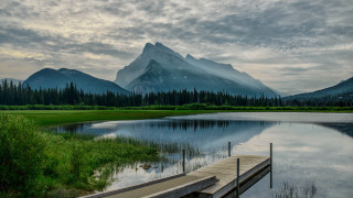 Mountain lake dock forest horizon - a dock in the foreground free wallpaper