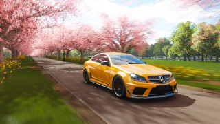 Yellow car pink flower trees - cinematic free wallpaper