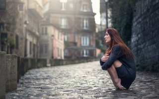 Woman cobblestone street cityscape redhaired - the background and a woman free wallpaper for desktop