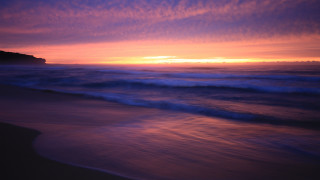 Sunset ocean waves rocks cityscape 6 - a sunset over the ocean free wallpaper for desktop