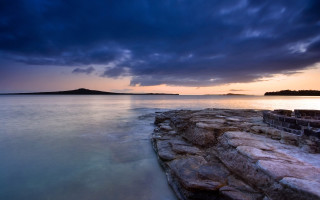 Rocky shore island cloudy sky - a rocky shore free wallpaper