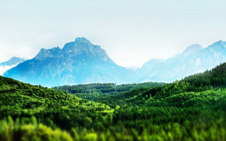 Mountain range forest blue sky 3 - a forest in the foreground free wallpaper