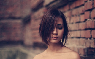 Woman brickwall closedeyes bun hair - short hair free wallpaper